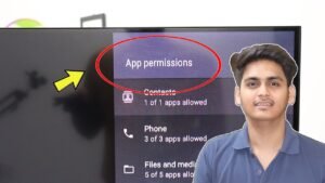 Person using a remote to manage app permission toggles on a smart TV screen with a privacy shield illustration