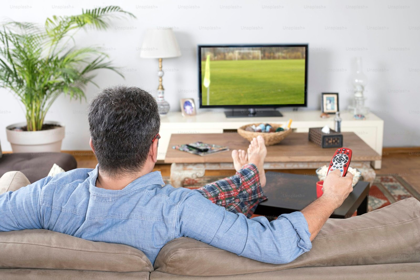 Three-screen home sports viewing space with viewers, cable management and ambient lighting