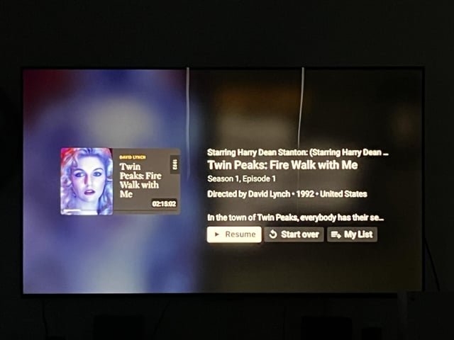 Smart TV interface showing content discovery and resume options for viewers
