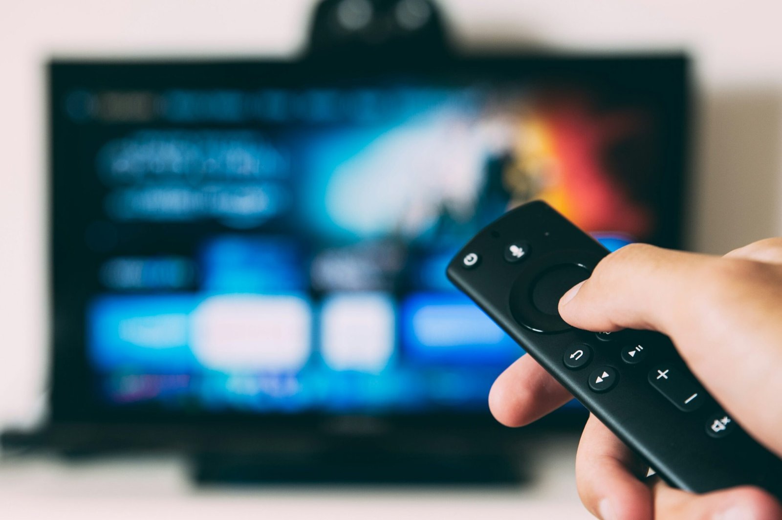Hand holding remote control for a streaming app